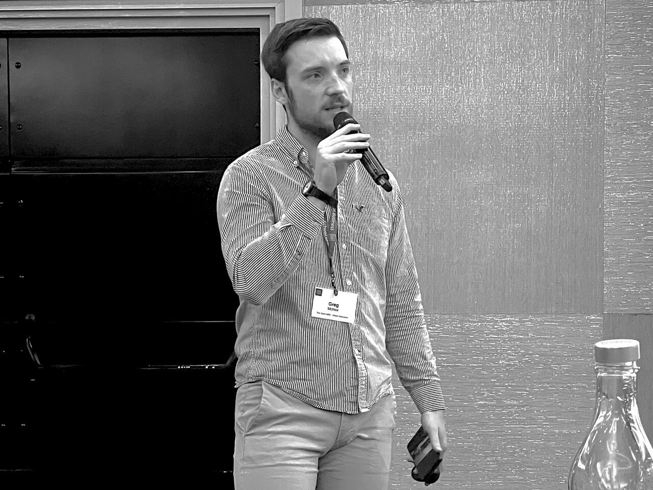 Greg speaking at an event